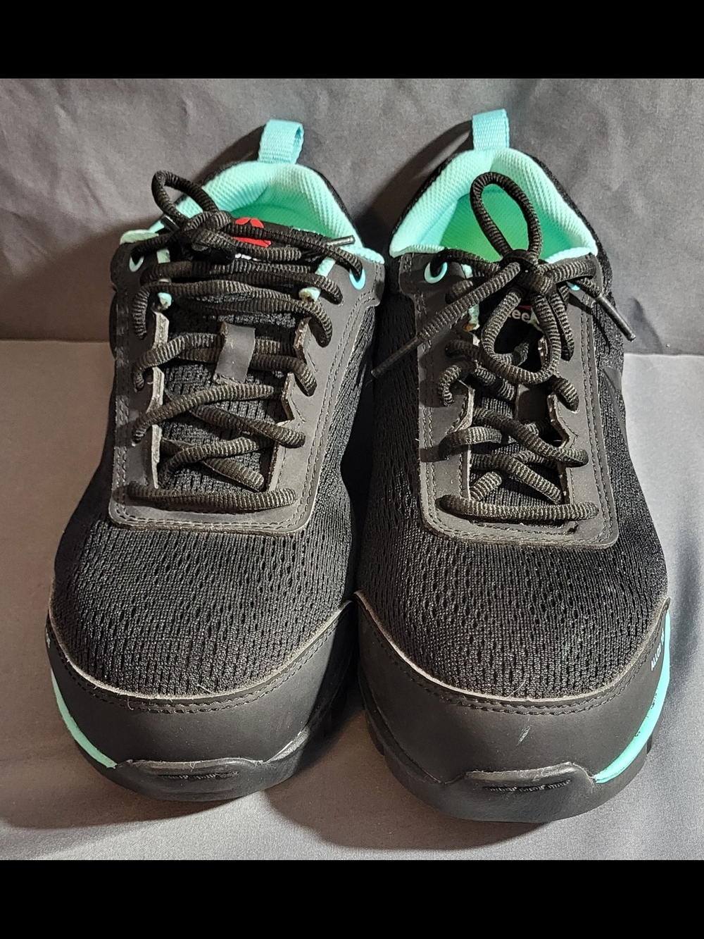 Reebok Women’s Black Sneakers with Mint Trim